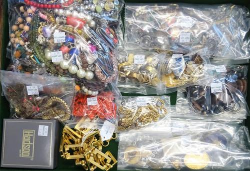 A large collection of costume jewellery, comprising; bracelets, brooches, pendants, rings, cufflinks, imitation coral, a gilt metal waistbelt, further