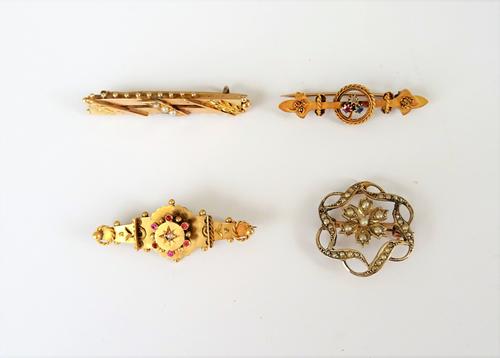 A gold and seed pearl brooch, pierced in a shaped hexagonal design, with a flower motif to the centre, a 9ct gold and seed pearl bar brooch, mounted w