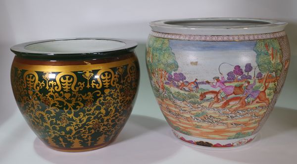 A 20th century Chinese style jardiniere painted with European hunting scene on a hardwood stand, 47cm wide x 66cm high, and another jardiniere with br