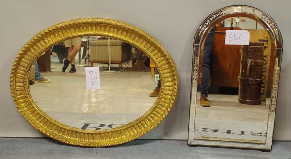 A 19th century gilt framed oval wall mirror, 70cm wide x 95cm high, and a 20th century Venetian arch top wall mirror, 48cm wide x 83cm high, (2). S1B