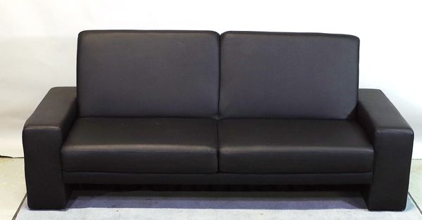 A 20th century faux black leather sofa bed, 193cm wide.