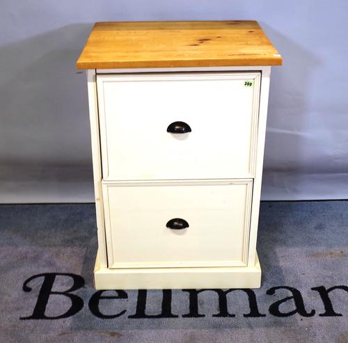 A modern two drawer painted pine cabinet with cup handles and a plinth base, 57cm wide.