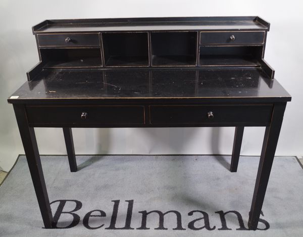 OKA; a black painted desk, with galleried back over a pair of drawers on tapering square supports, 120cm wide x 102cm high and a matching open armchai