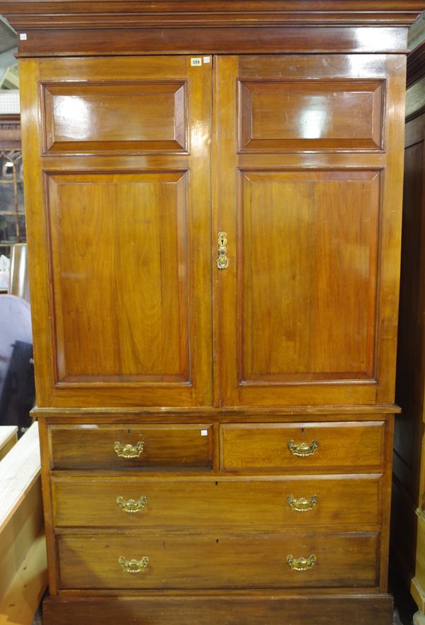 A Victorian walnut linen press, the pair of double panel doors over two short and two long graduated drawers, 131cm wide x 211cm high.