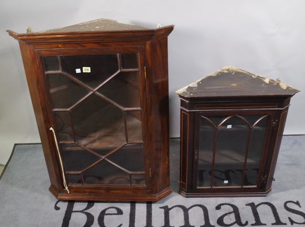 A mahogany hanging corner display cabinet, 69cm wide x 90cm high, together with a similar smaller, (2).