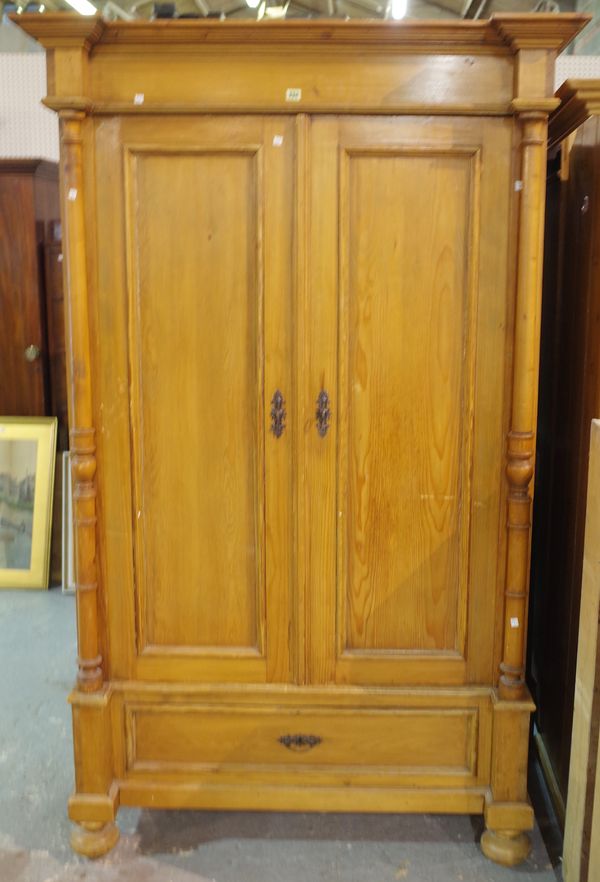 A 20th century French Empire style wardrobe with single drawer to base, 124cm wide x 192cm high.