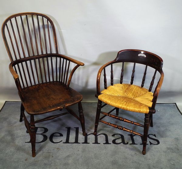 A late 18th century elm Windsor armchair and a late 19th century smokers chair, (2).