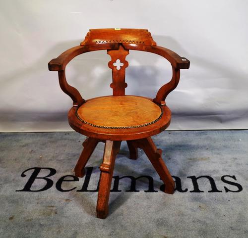 Shoolbred & Co; an early 20th century oak office armchair, 55cm wide x 81cm high.