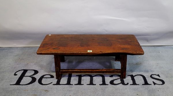 A 19th century Chinese elm low table, 82cm wide x 27cm high.