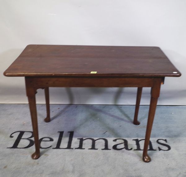 A late 18th century mahogany tavern table on tapering pad feet, 103cm wide x 68cm high.