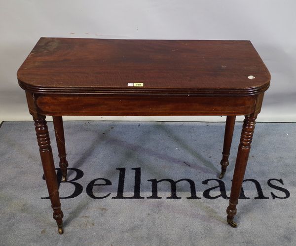 A late Victorian mahogany foldover tea table on ring turned tapering supports, 91cm wide x 76cm high.