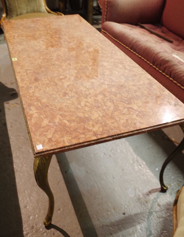 A mid-20th century rectangular marble and brass coffee table on acanthus moulded scroll supports, 140cm wide x 47cm high.