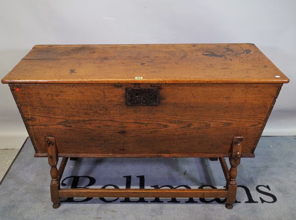 A late 18th century French elm dough bin on block supports, 126cm wide x 80cm high.