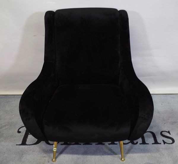 A retro design shell back armchair on lacquered brass supports, 85cm wide x 90cm high.