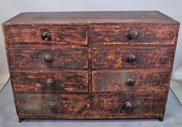 A 19th century stained pine chest with two banks of three short drawers over one long, 138cm wide x 96cm high.