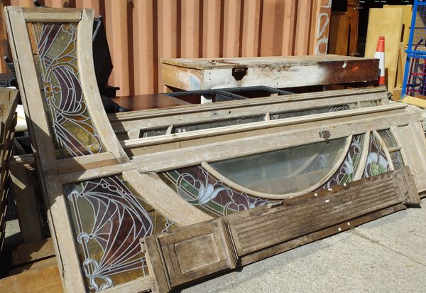 The major components of a late 19th century pine framed door and matching side panels with stain glass Art Nouveau glass panels, approx 225 wide x 315