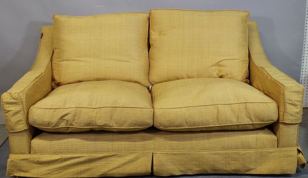 A 20th century gold upholstered sofa with downswept arms, 170cm wide x 80cm high.