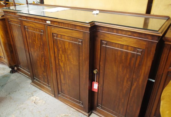 A George III mahogany breakfront side cabinet with four panelled doors, 200cm wide x 102cm high.