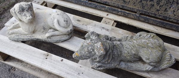 A 20th century reconstituted stone figure of a recumbent dog, 50cm wide x 19cm high, and another similar, 40cm wide x 23cm high, (2).