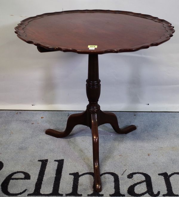 A George III mahogany tripod table, the dished top on three downswept supports, 67cm wide x 69cm high.