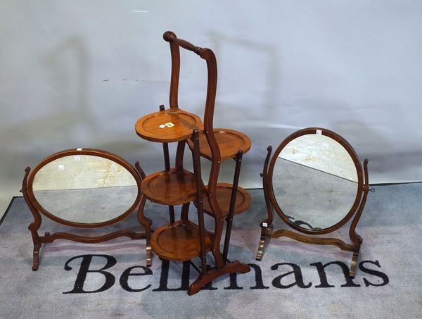 An Edwardian mahogany five tier folding cake stand, 91cm high, and two late Victorian mahogany dressing table mirrors, the largest 53cm wide x 50cm hi