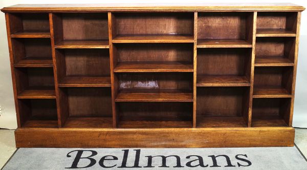 A 20th century oak open bookcase, 205cm wide x 104cm high.