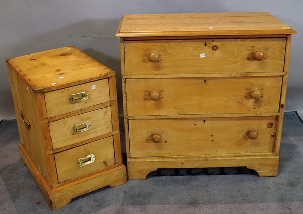 A 20th century pine chest of three long drawers, 82cm wide x 80cm high, and a 20th century pine three drawer pedestal, 38cm wide x 62cm high, (2).