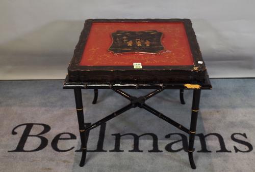 A 19th century Chinese export black and polychrome square box, hinged panel inset lid above compartmented interior on later stand, 59cm wide, 54cm hig