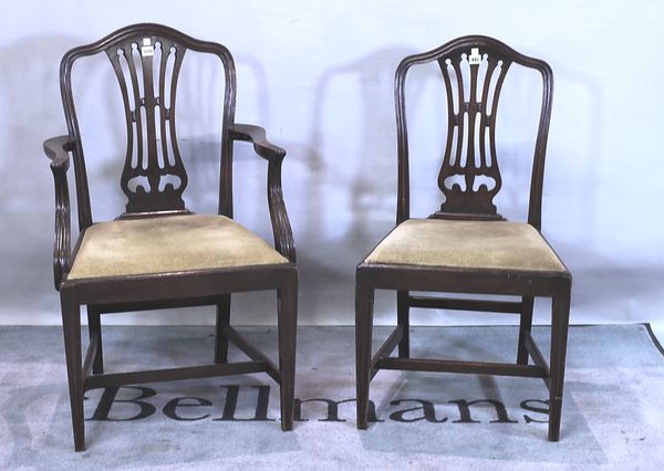 A set of seven George III style mahogany dining chairs with pierced splat on tapering square supports, to include one carver. (7)