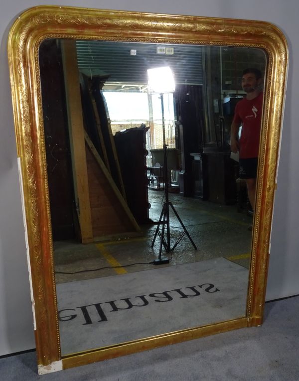 A 19th century gilt framed arched top mirror with floral chased frame, 111cm wide x 140cm high.  4739