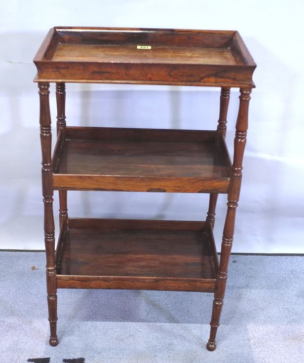 A Charles X rosewood three-tier étagère with rectangular tray top on ring-turned supports, 42cms wide, 71.5cms high.