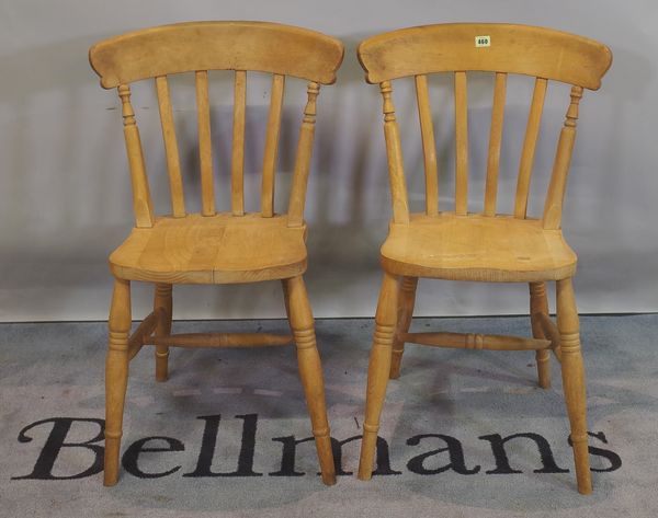 A pair of 20th century beech stick back dining chairs, (2).