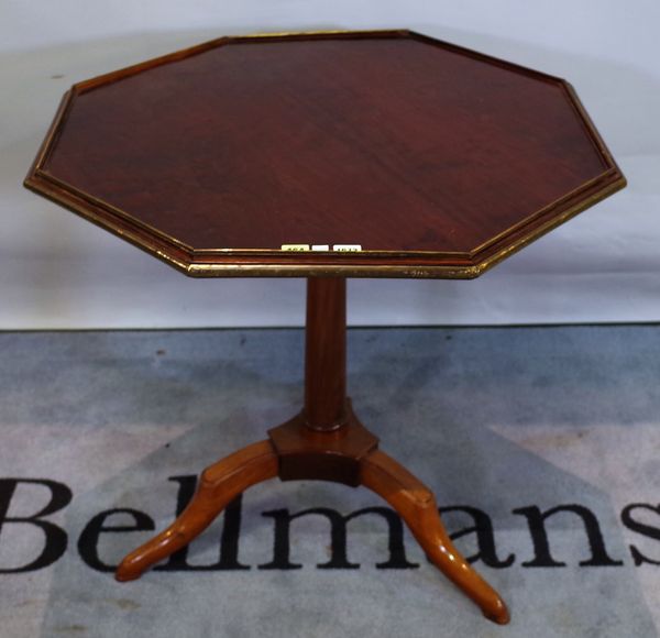 A late Louis XVI brass mounted mahogany tripod occasional table with octagonal snap top, 79cm wide x 76cm high.