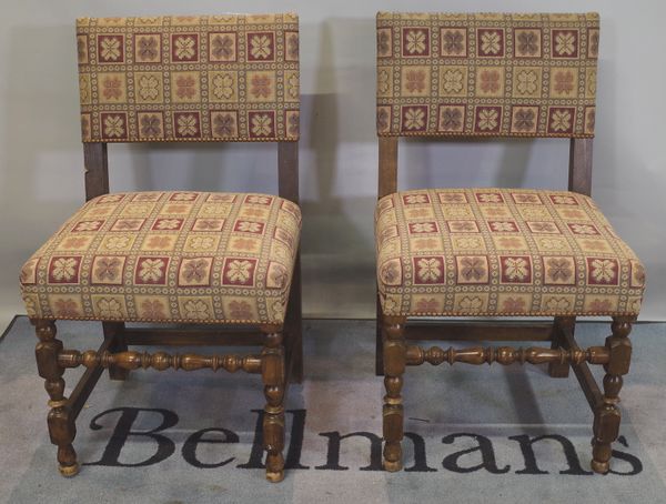 A set of six 18th century style oak bar back dining chairs with studded upholstery, (6).