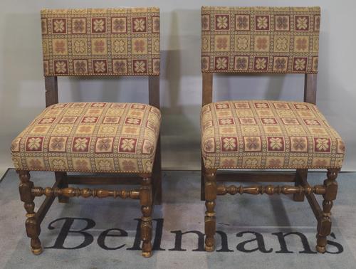A set of six 18th century style oak bar back dining chairs with studded upholstery, (6).