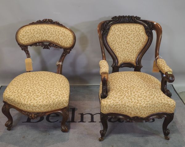 A Victorian mahogany framed open armchair on cabriole supports and another similar, 59cm wide x 89cm high, (2).