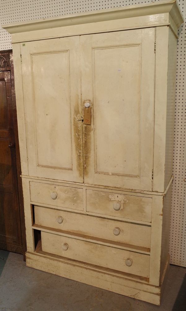 An early 20th century white painted pine linen press with two short and two long drawers on plinth base, 120cm wide x 200cm high.