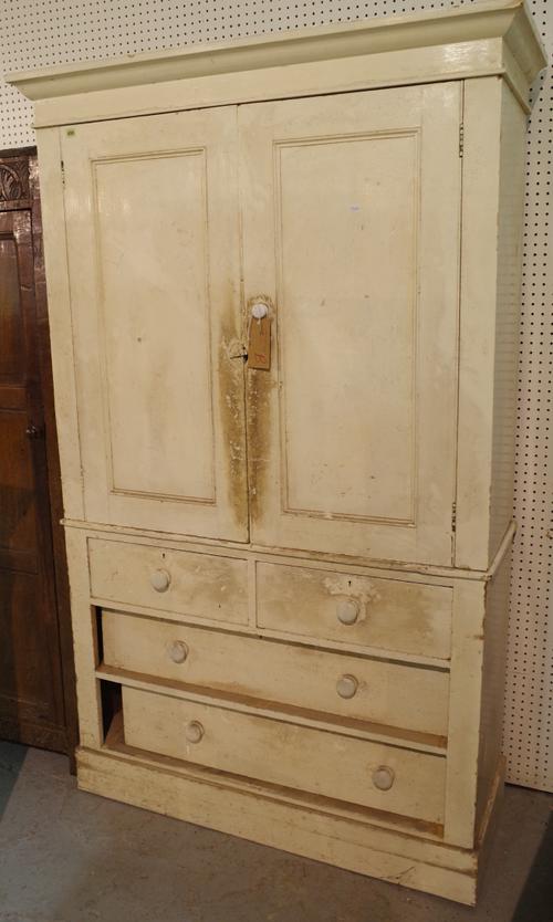 An early 20th century white painted pine linen press with two short and two long drawers on plinth base, 120cm wide x 200cm high.