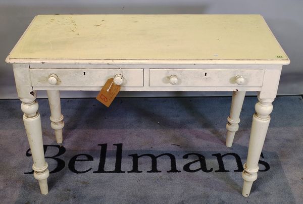 A late Victorian white painted two drawer side table on tapering supports, 105cm wide x 73cm high.