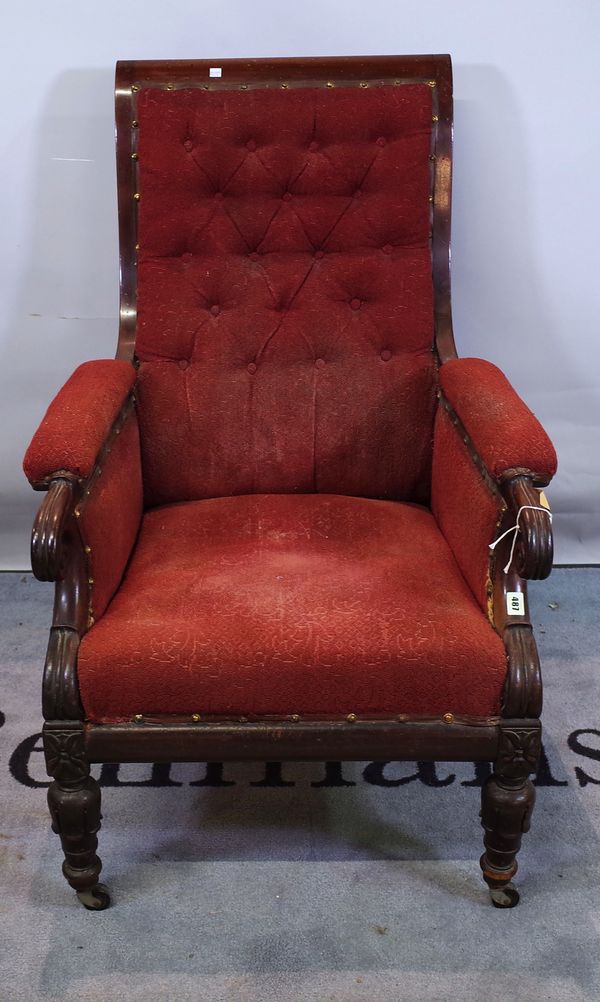 A Victorian mahogany framed armchair with red button back upholstery on tapering supports, 73cm wide x 102cm high.