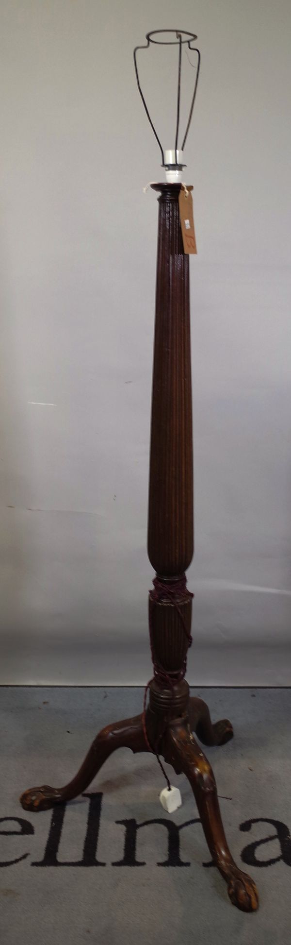 A Victorian mahogany standard lamp on fluted column and ball and claw feet, 149cm high.