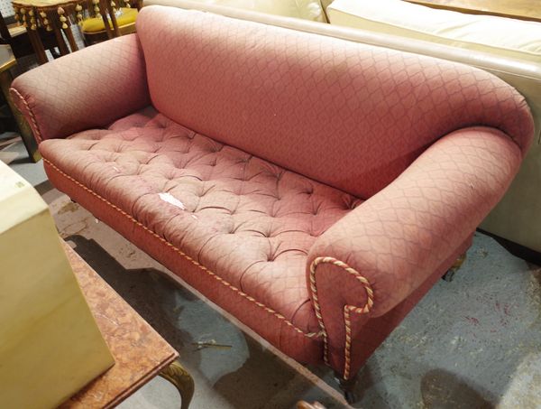 A late Victorian mahogany framed Chesterfield style sofa with pink button back upholstery, 195cm wide.