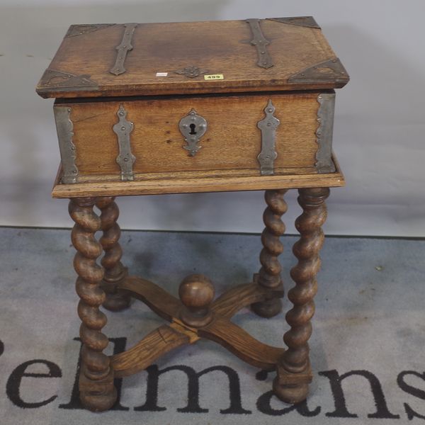 An 18th century oak bible box on later added 'X' frame stand, 52cm wide x 77cm high.