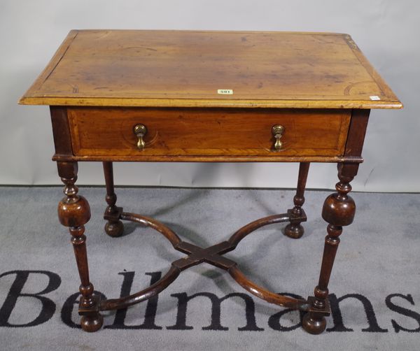 An 18th century walnut single drawer side table with turned supports and 'X' frame stretcher, 80cm wide x 70cm high.