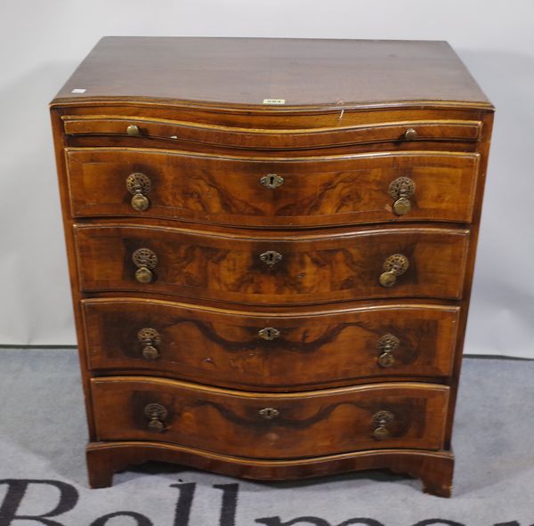 A 19th century walnut serpentine chest of four long drawers, 68cm wide x 72cm high.