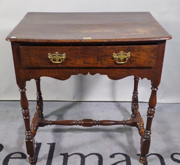 An 18th century oak single drawer side table on turned supports united by 'H' frame stretchers, 70cm wide x 70cm high.