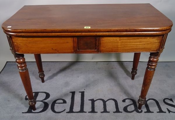 A Victorian mahogany foldover tea table on turned tapering supports, 96cm wide x 74cm high.