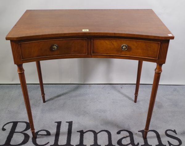 A 20th century mahogany concave fronted two drawer side table, 87cm wide x 79cm high.