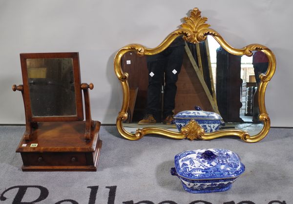 A modern gilt framed wall mirror with acanthus crest, 60cm wide, a 19th century mahogany toilet mirror, 40cm wide, and a blue and white tureen and cov