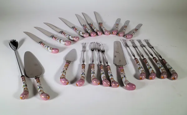 A part suite of cutlery with German porcelain handles comprising; seven knives, seven forks, three butter knives and four serving implements. CAB